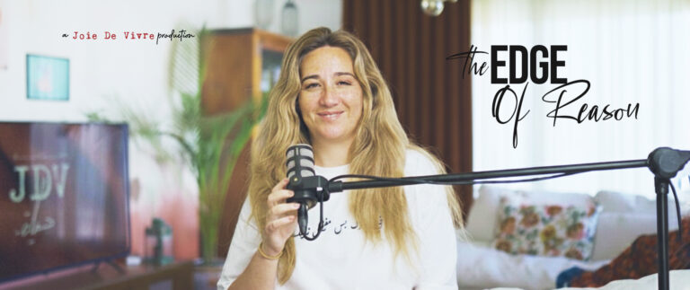 Empowered woman podcast host with microphone, inspiring discussion on the edge of reason, personal growth, and motivation for success.