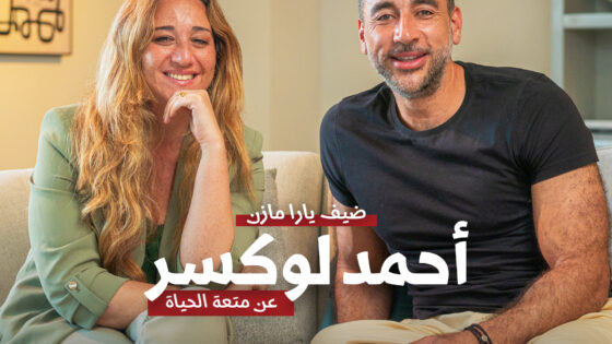 Happy couple smiling together, relaxed in living room, promoting lifestyle and real estate insights by JDV.